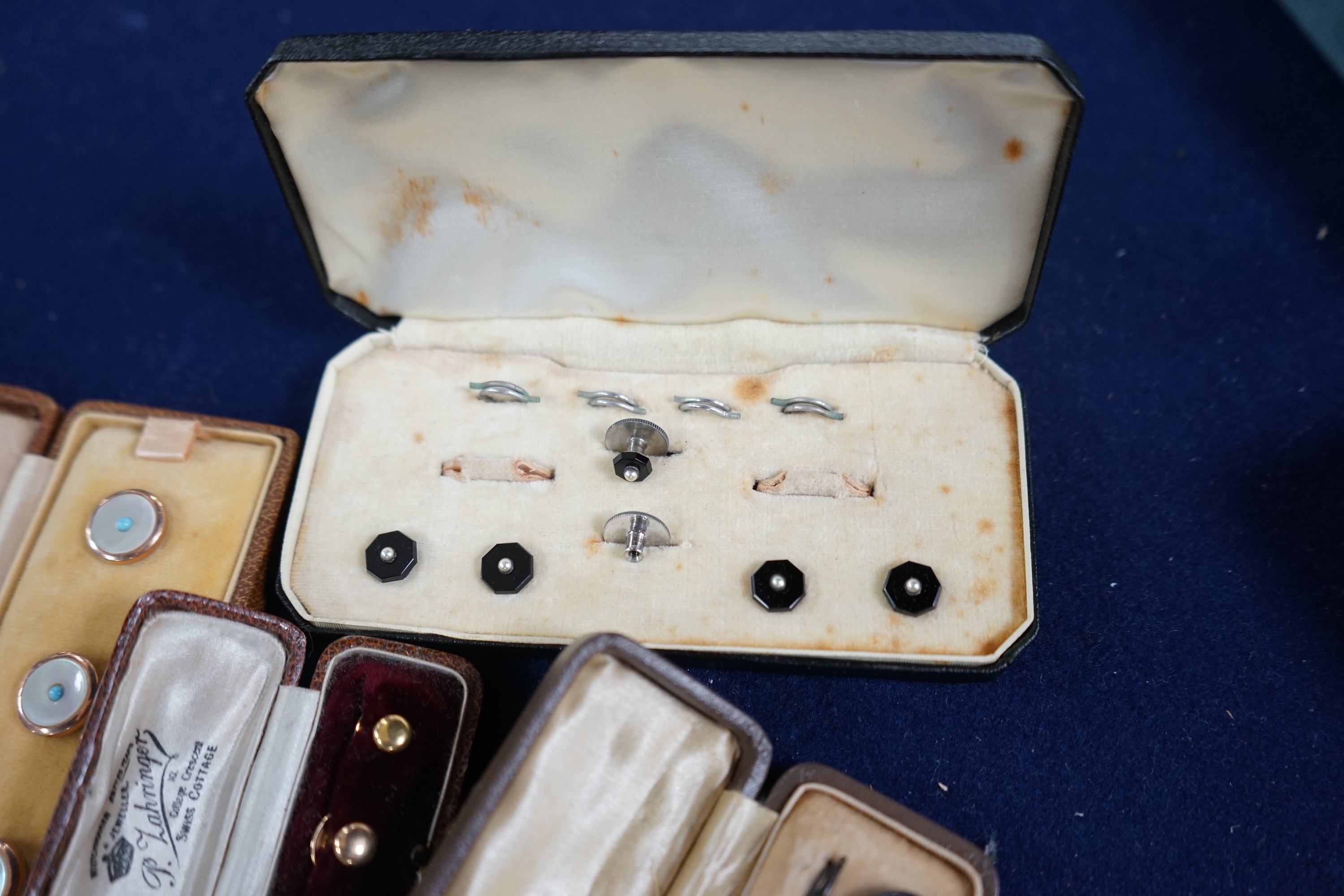 Two cased sets of three 18ct dress studs, 5.9 grams and three other cased sets of studs, one incomplete. Condition - fair to good